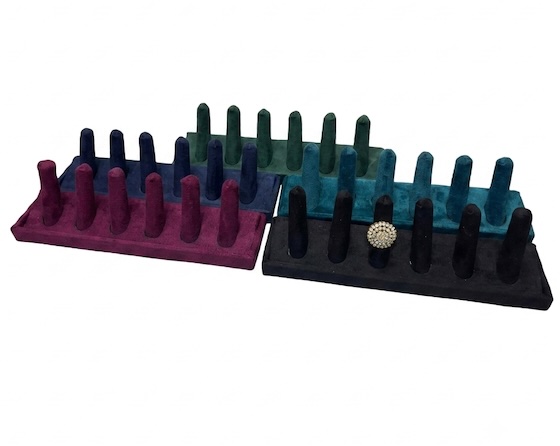 velvet 6-slot ring display stand for jewelry store display with decorative pearl ring showcased on soft velvet holder.